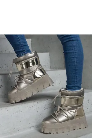 Golden snow boots on a platform